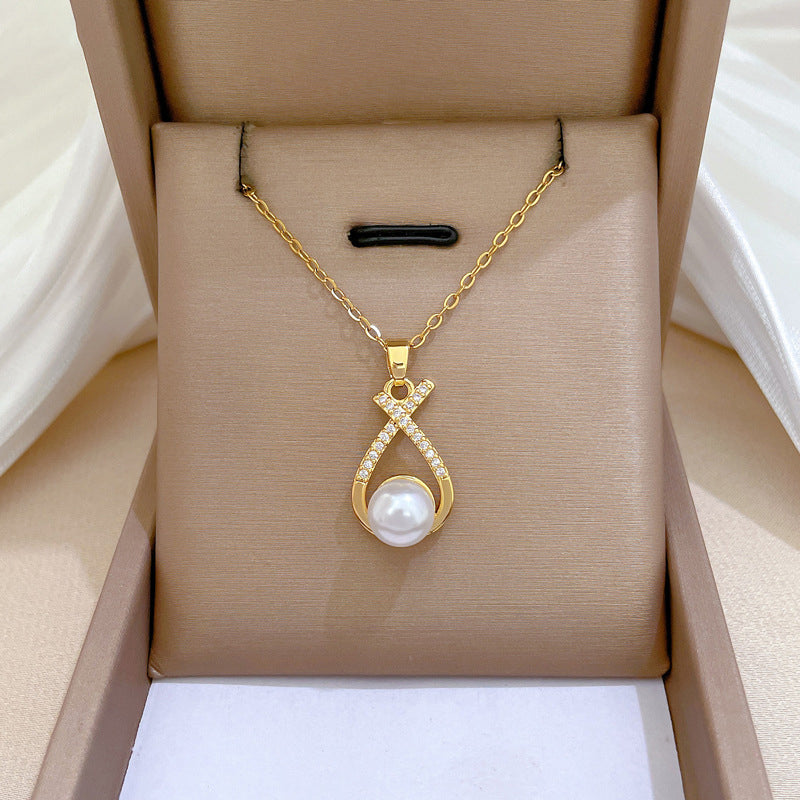 Conjunto nudo cruzado de piedras con perla