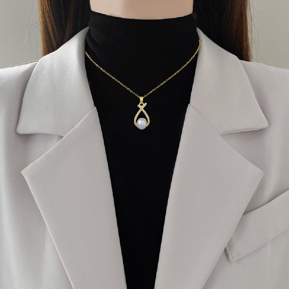 Conjunto nudo cruzado de piedras con perla